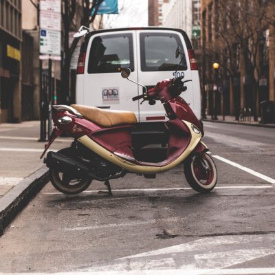 Photo by Brandon Wilson red and beige motor scooter